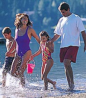 A family strolling along the beach